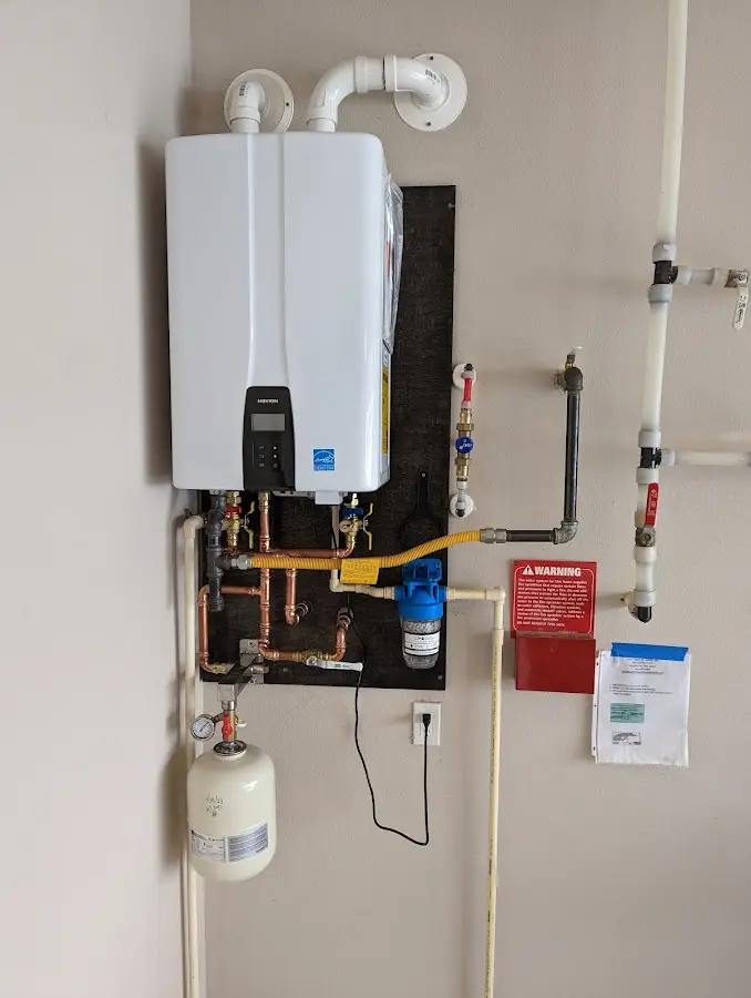 Professional plumber installing copper piping in a West Vero Corridor home